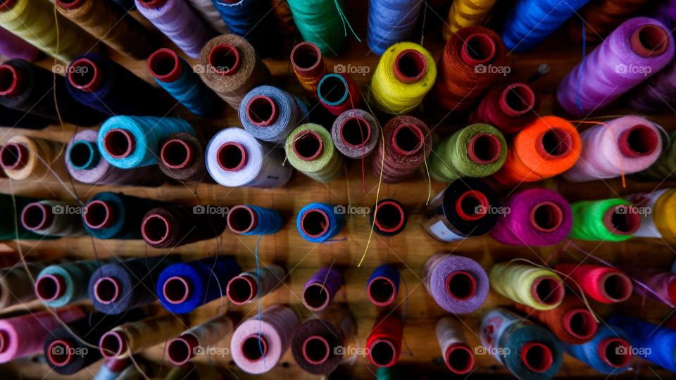 collection of sewing threads of various colors