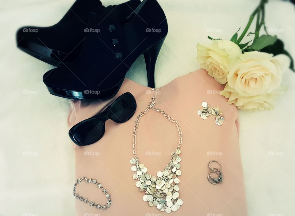 Sunglasses,  heels, jewelry and a top all accessorize very well.