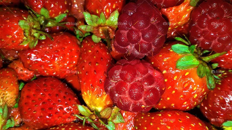 Strawberry and raspberry closeup. Healthy life.