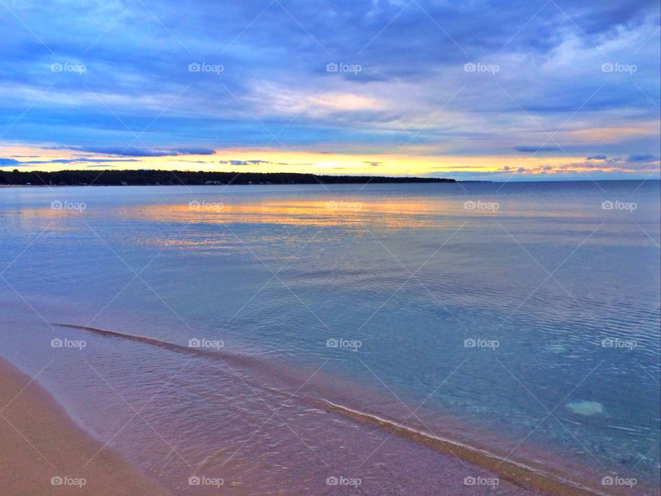 Sun setting over the water