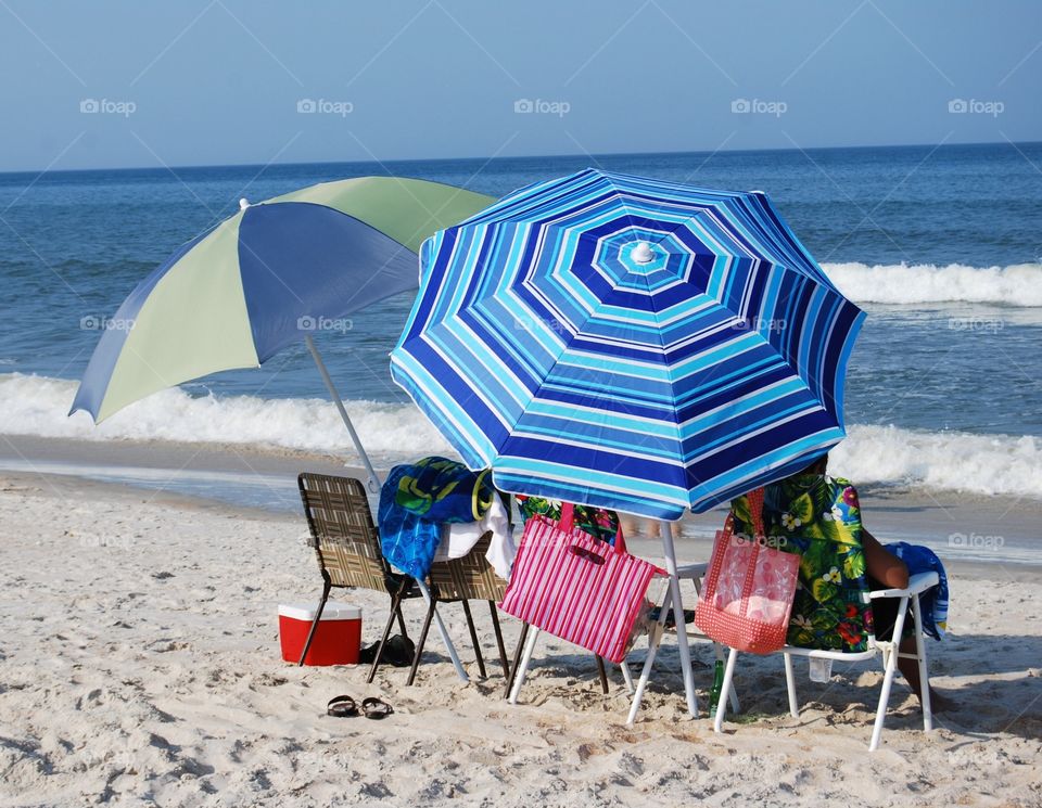 Umbrellas at the beach. Relaxing at the beach