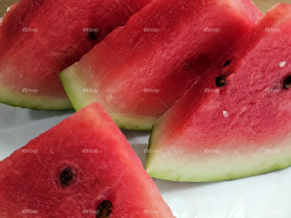 A quintessential summertime delight; slices of cold,  sweet watermelon to quench your appetite and your thirst.