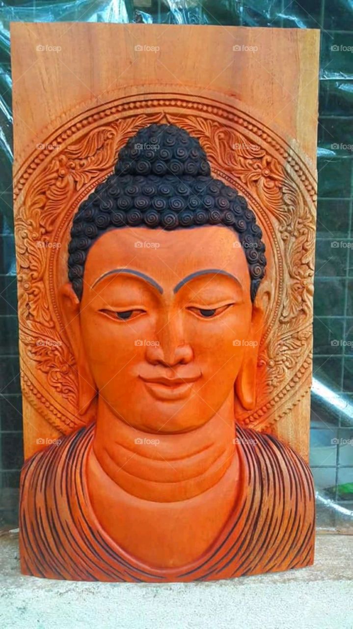 wood carving buddha