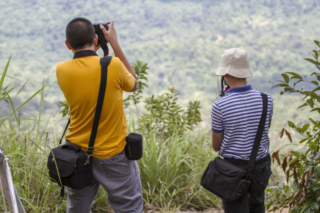 Taking photo. My son taking photo of mountain scenery 