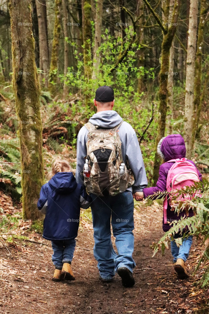 Father hiking with his children