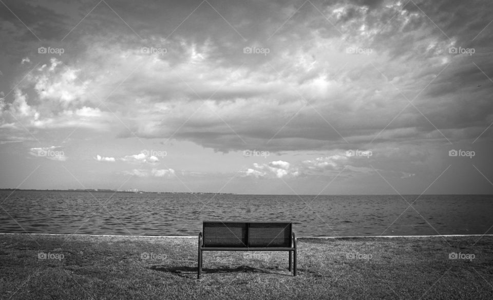 Bench Overlooking the Ocean and Clouds
