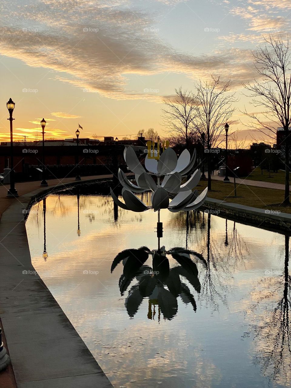 Reflections in the water at sunset on Carroll Creek in Frederick Maryland 