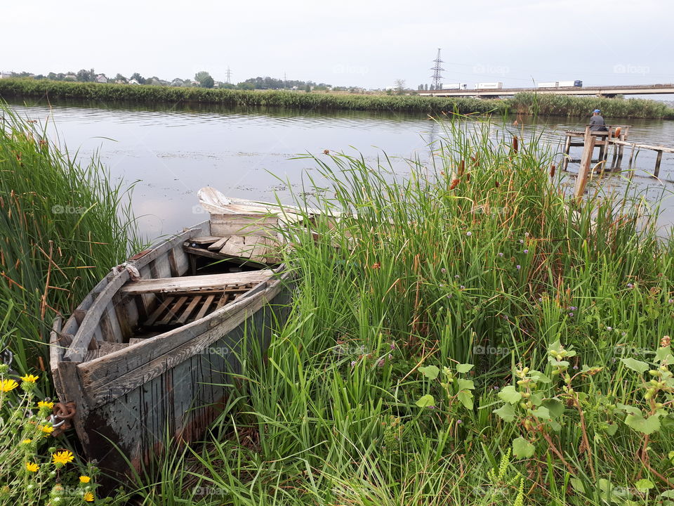 Old wooden boat at the river