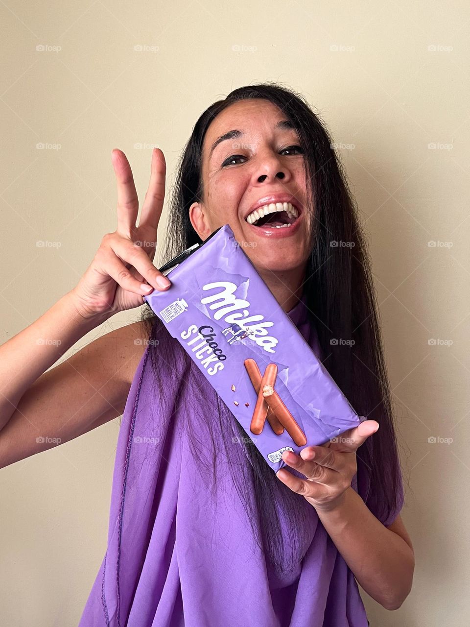 Energetic, Light-Hearted Portrait of Beautiful Smiling Woman with Milka Chocolate Sticks