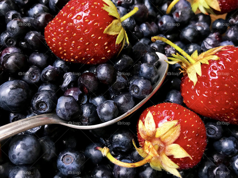 Fresh ripe strawberries and blueberries 