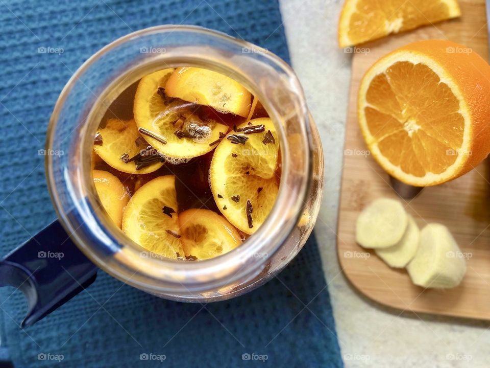 Warming tea with ginger and oranges 