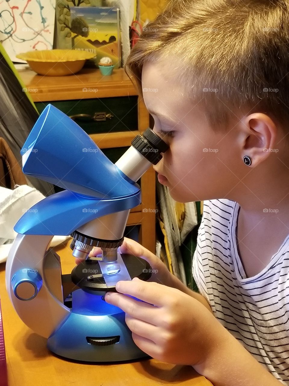 child using microscope