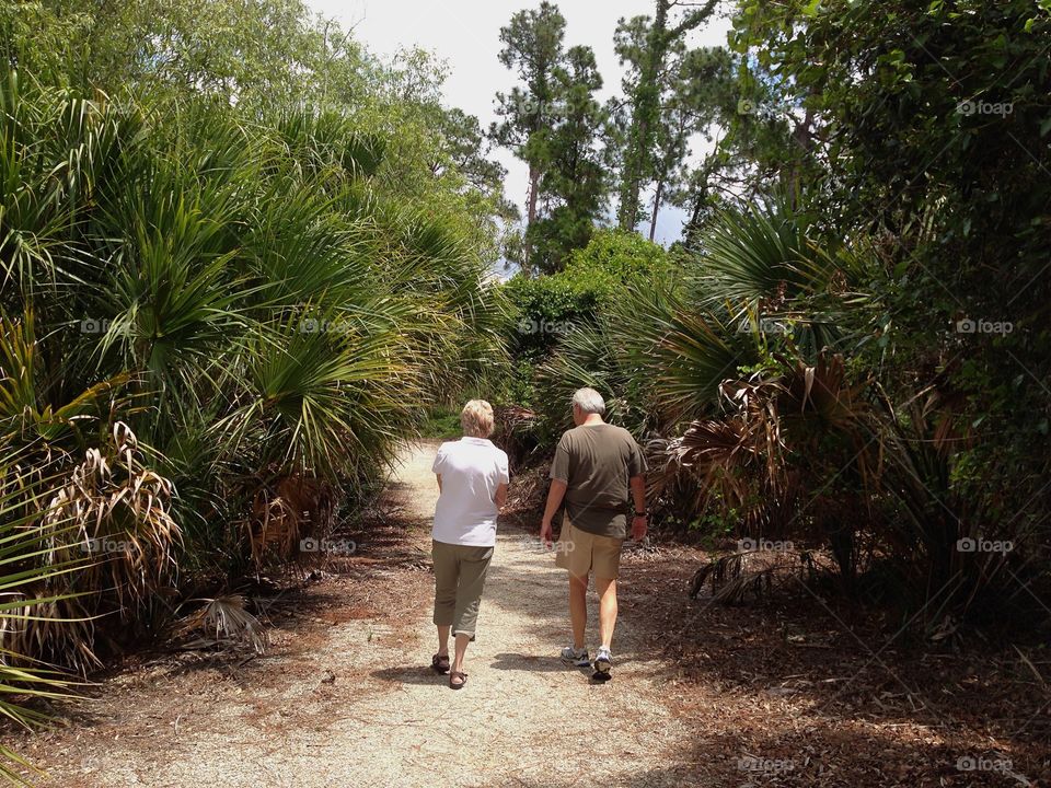 Walking through the woods to stay physically and mentally fit.