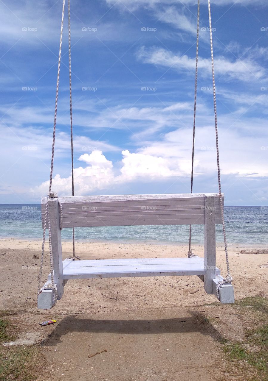 swing chair on beach