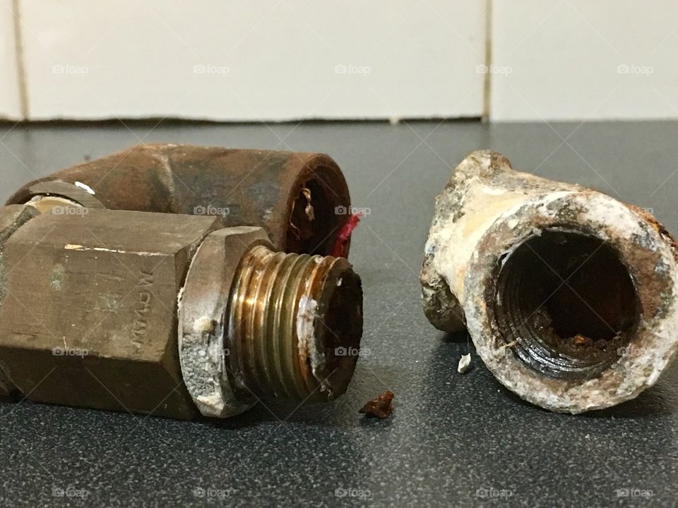 Rusted corroded pipes, sitting on counter plumbing industry