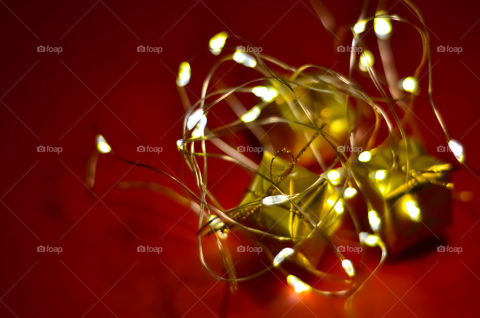 Christmas lights. Red and golden colors.