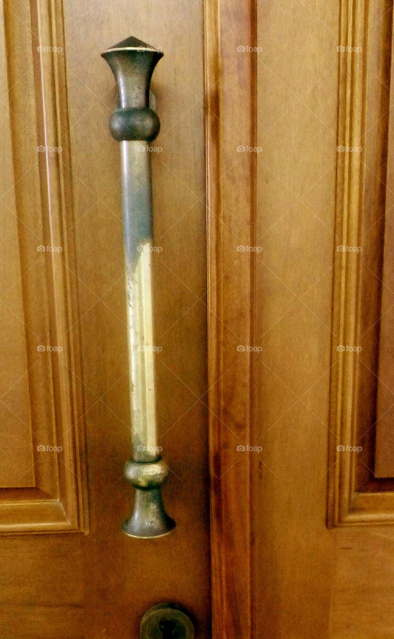 Vintage wooden golden door design with iron old handle