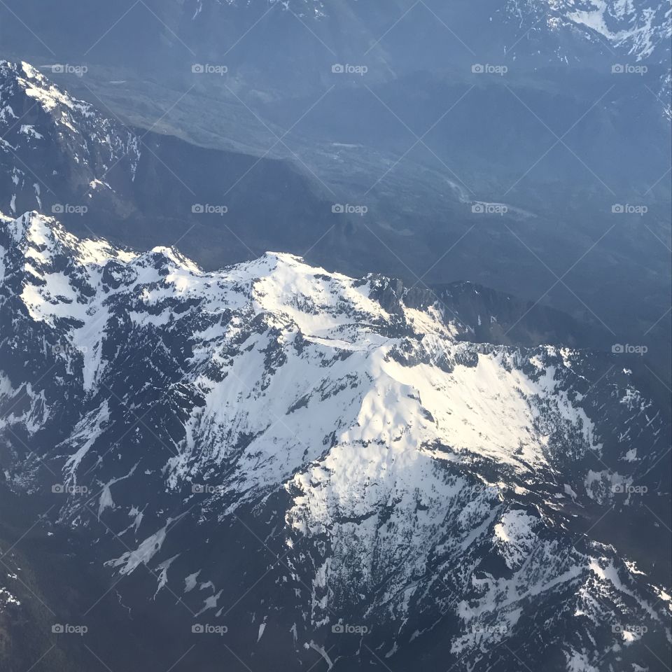 A very foggy morning in the mountains during a summer camping trip captured from a helicopter.