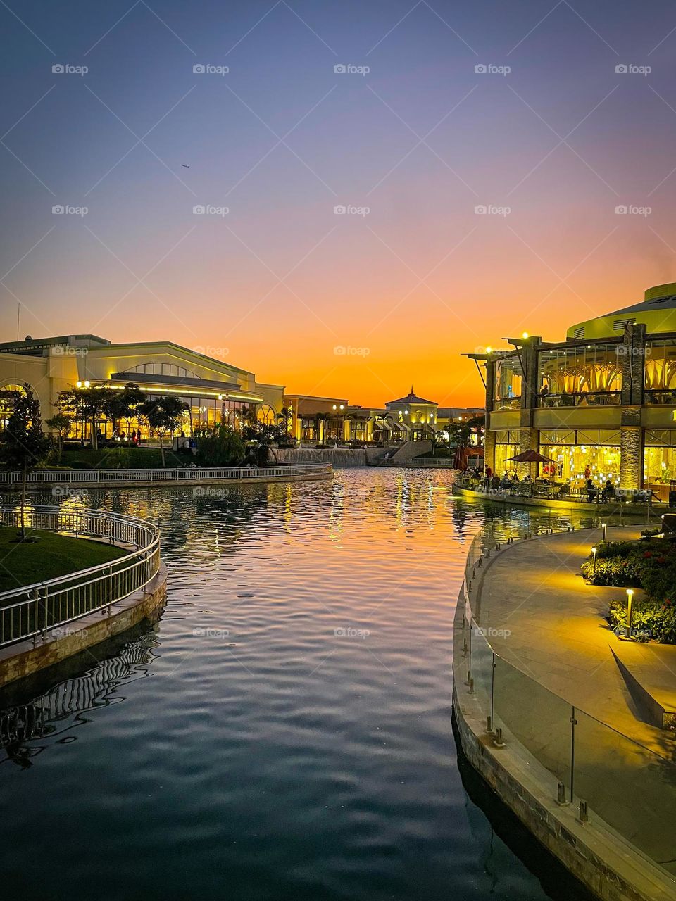 Open Air Mall in Madinaty, New Cairo. View at sunset if manmade water canal and restaurants.