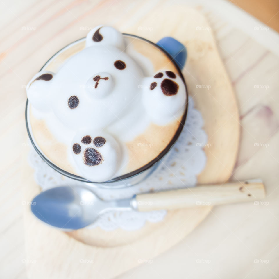 Cute latte art, 3d latte art of teddy bear made from thick milk foam. Hot chocolate or hot latte.