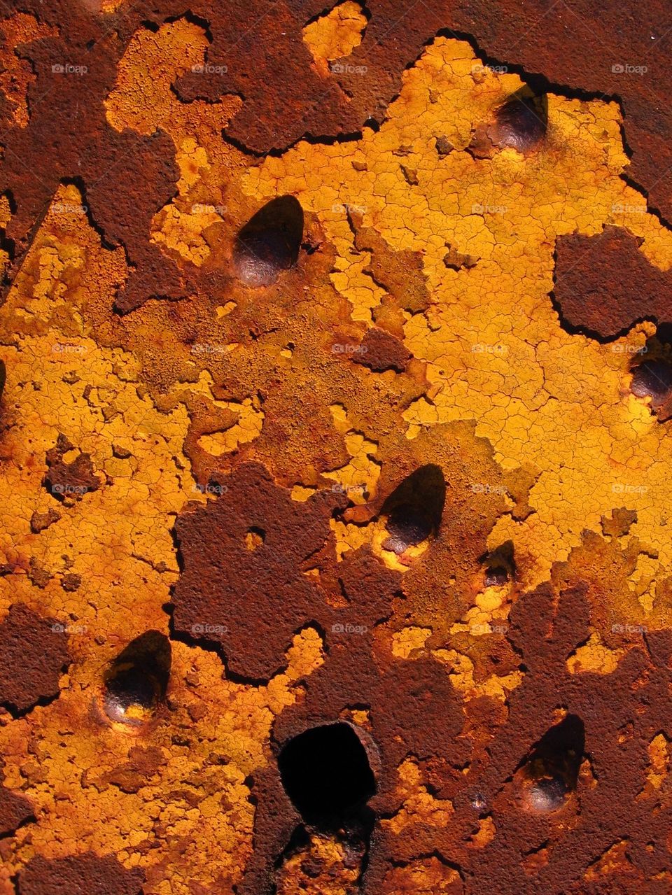 Rust and peeling yellow paint