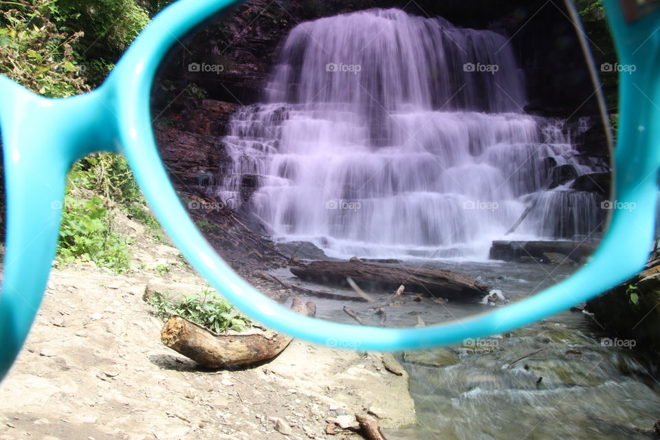 Looking at a waterfall through the sunglasses