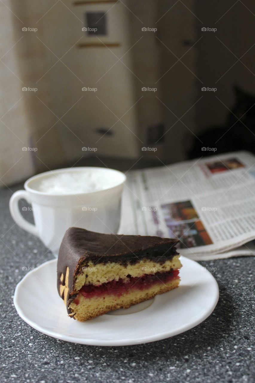 Morning coffee with cake and cat