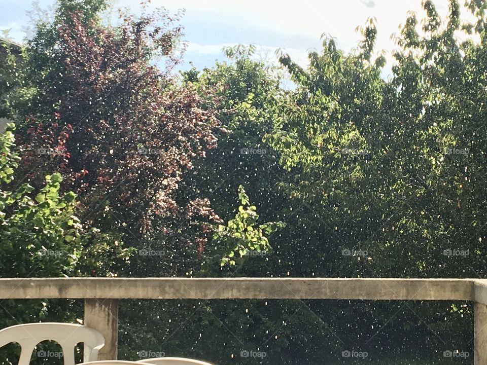 Heavy rain drops with sunshine