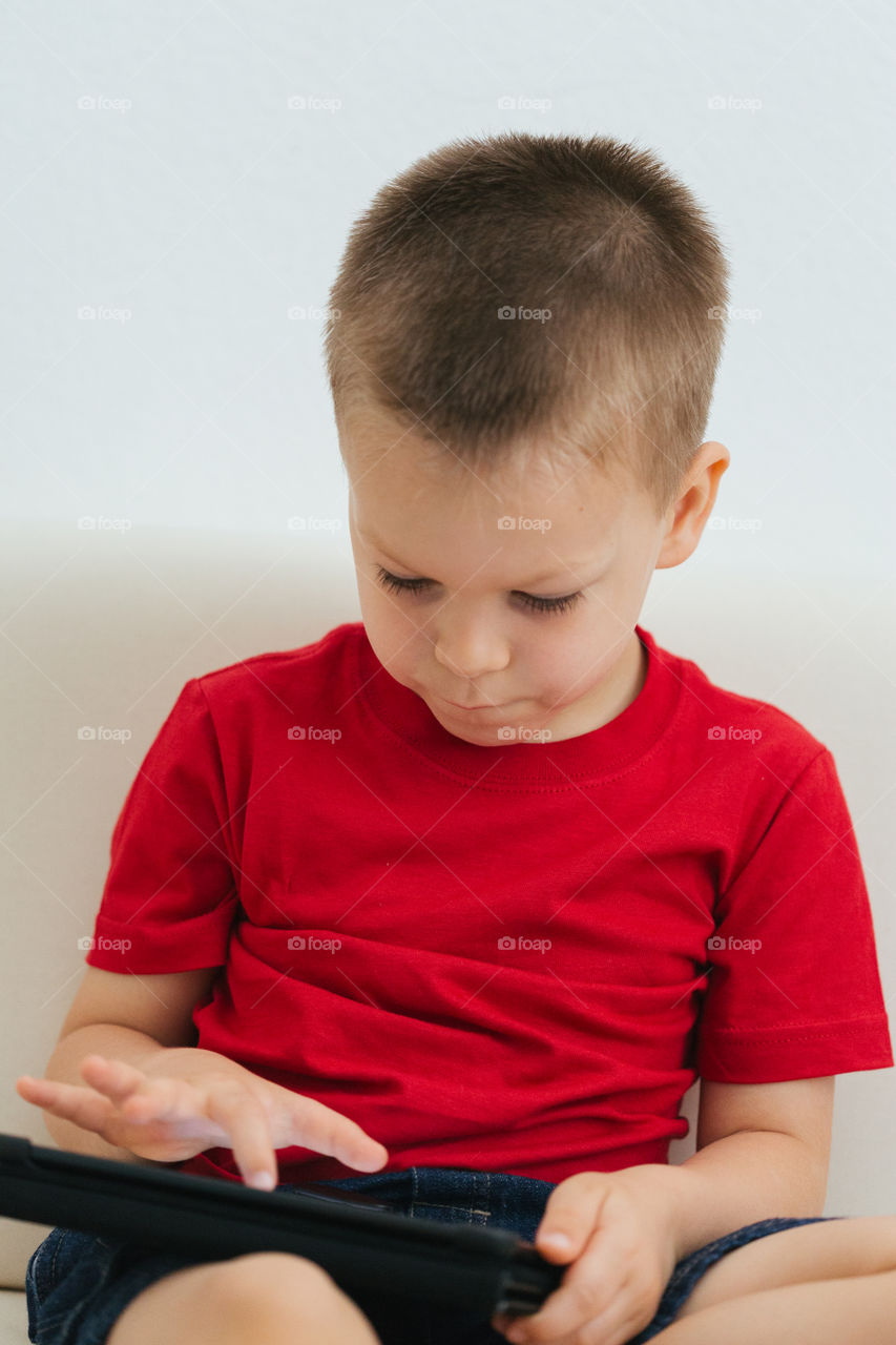 Toddler on tablet Playing games 