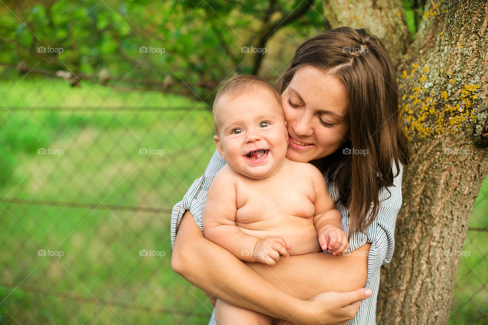 Woman carrying with baby