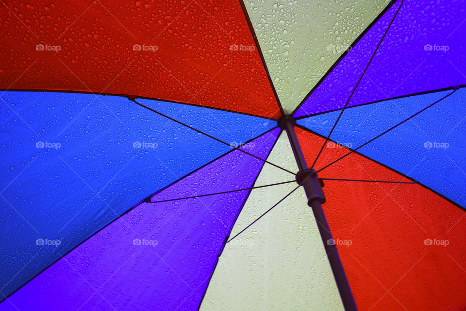 Under the colourful umbrella