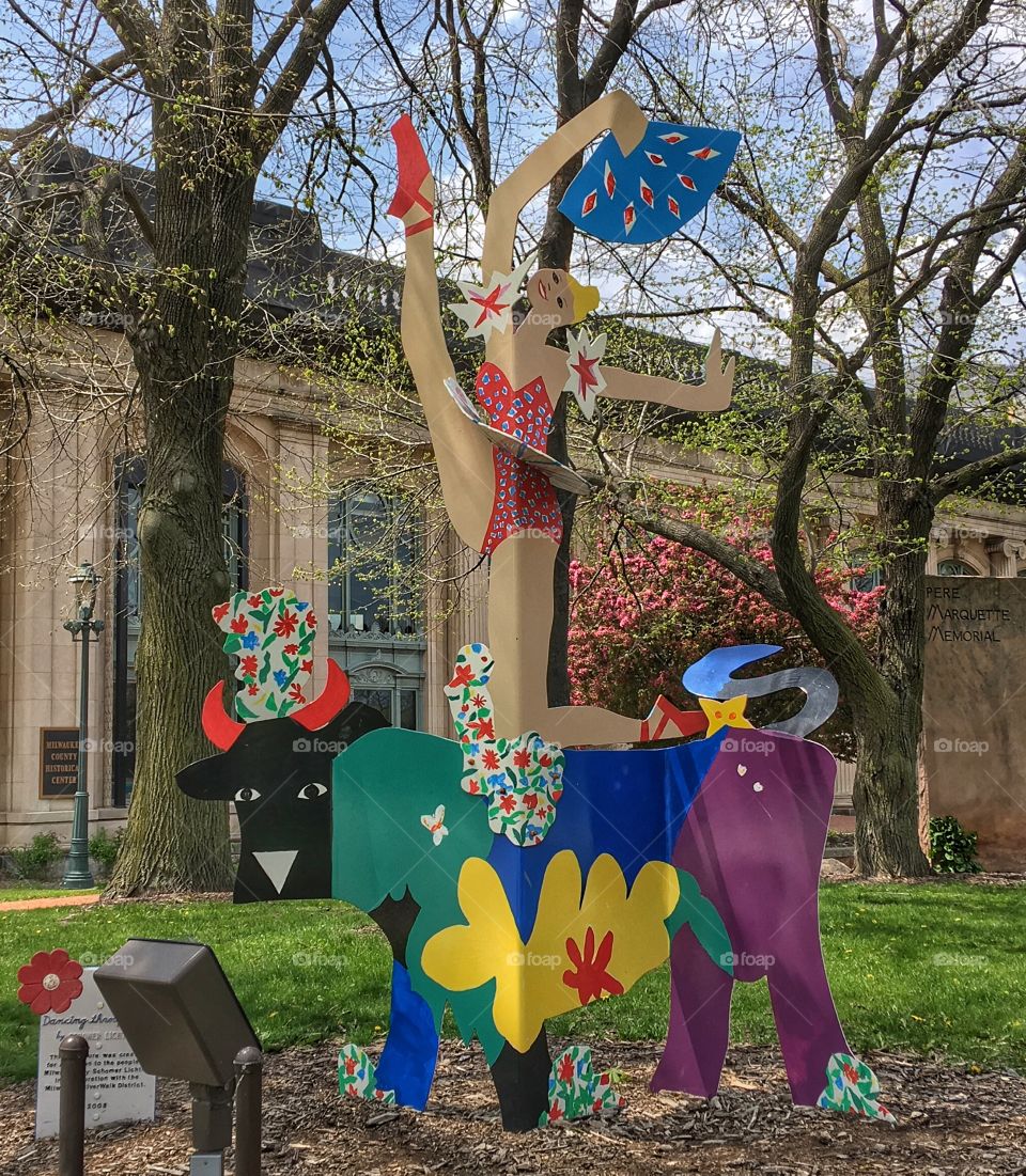 Cutout of woman on cattle