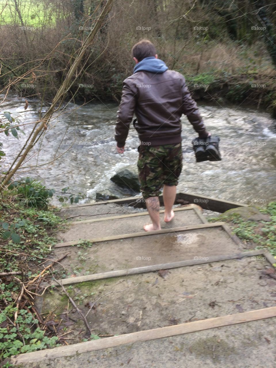 Man walking barefoot in nature. 