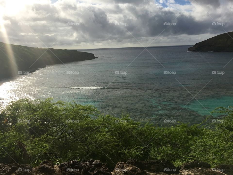 Sun shining over sea