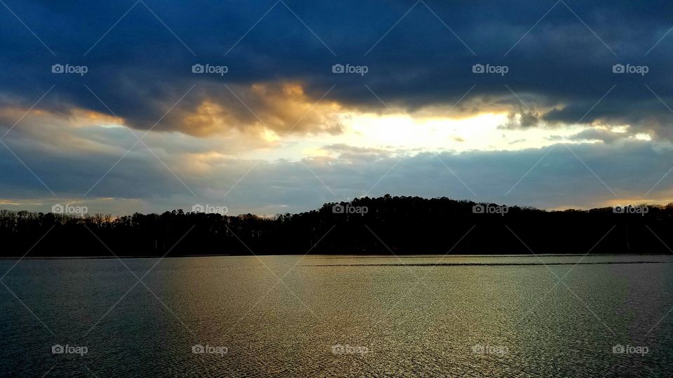 dusk on the lake.  clouds over the island.