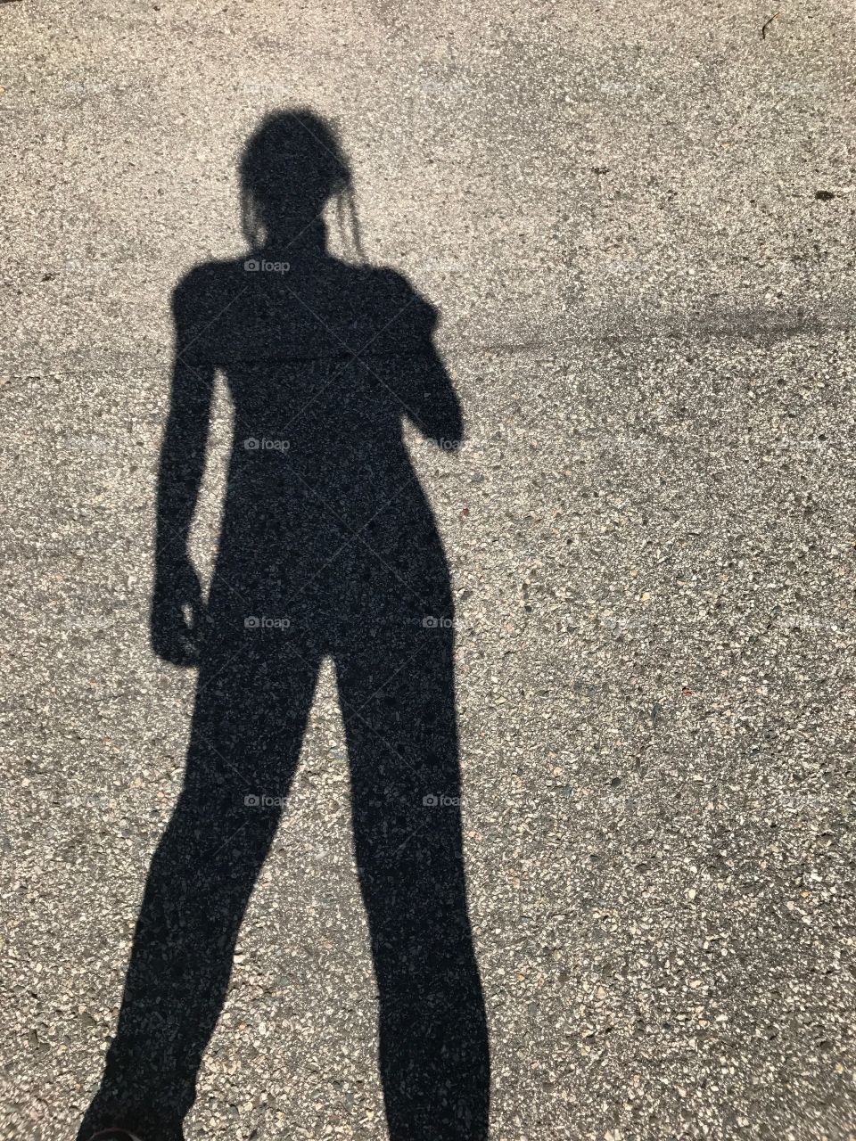 Shadow on blacktop. There’s something so sleek about this long shadow on asphalt. I couldn’t help but take the photo!