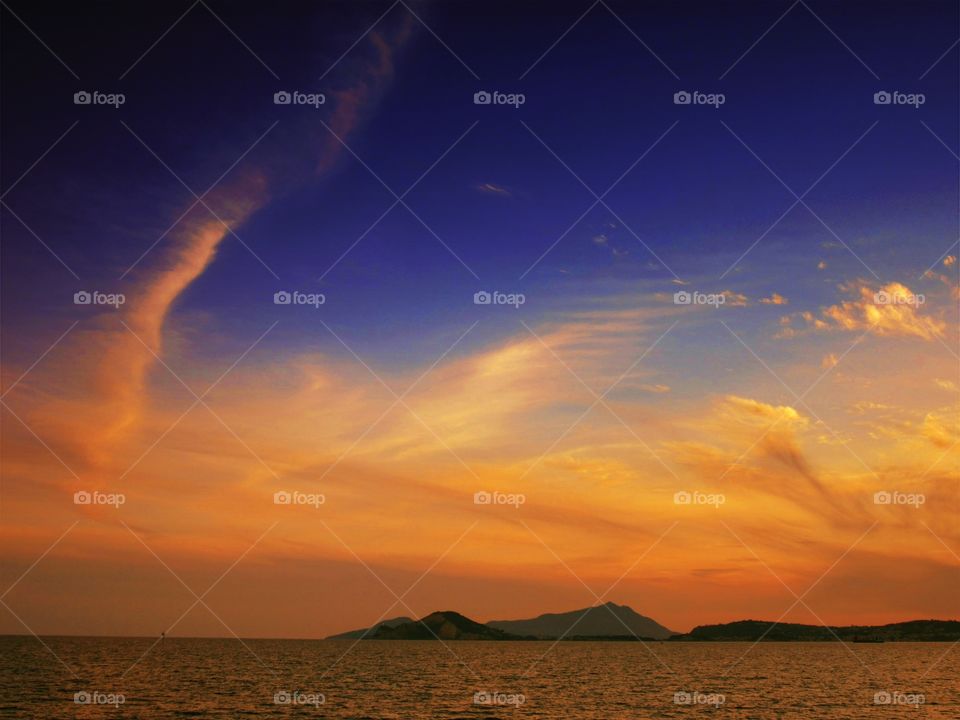 Dramatic sky over the sea at sunset