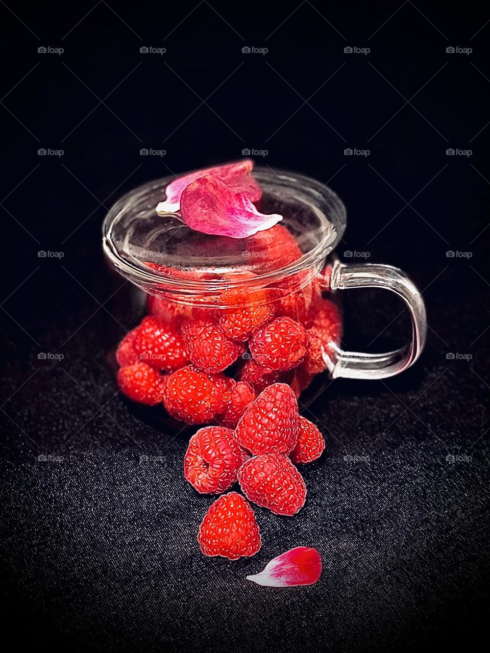 Raspberries in a glass cup