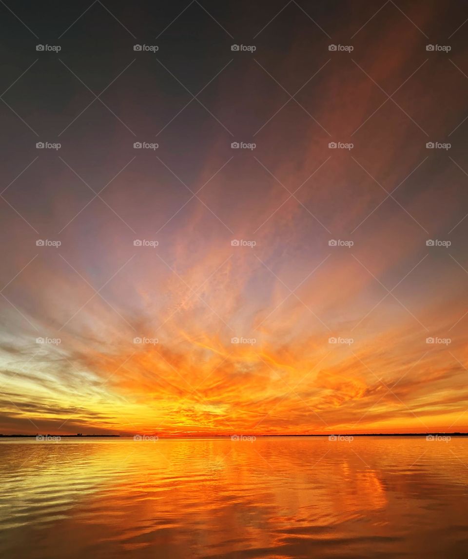 The sky erupted in spectacular golden hues of pink, mauve, gold and orange moments before the sun sunk below the horizon in the Ocean Beach giving the fabulous hillside residents a fabulous and unforgettable sunset.