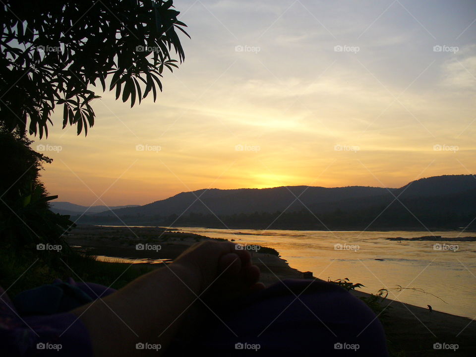sunset river mountain in thailand.