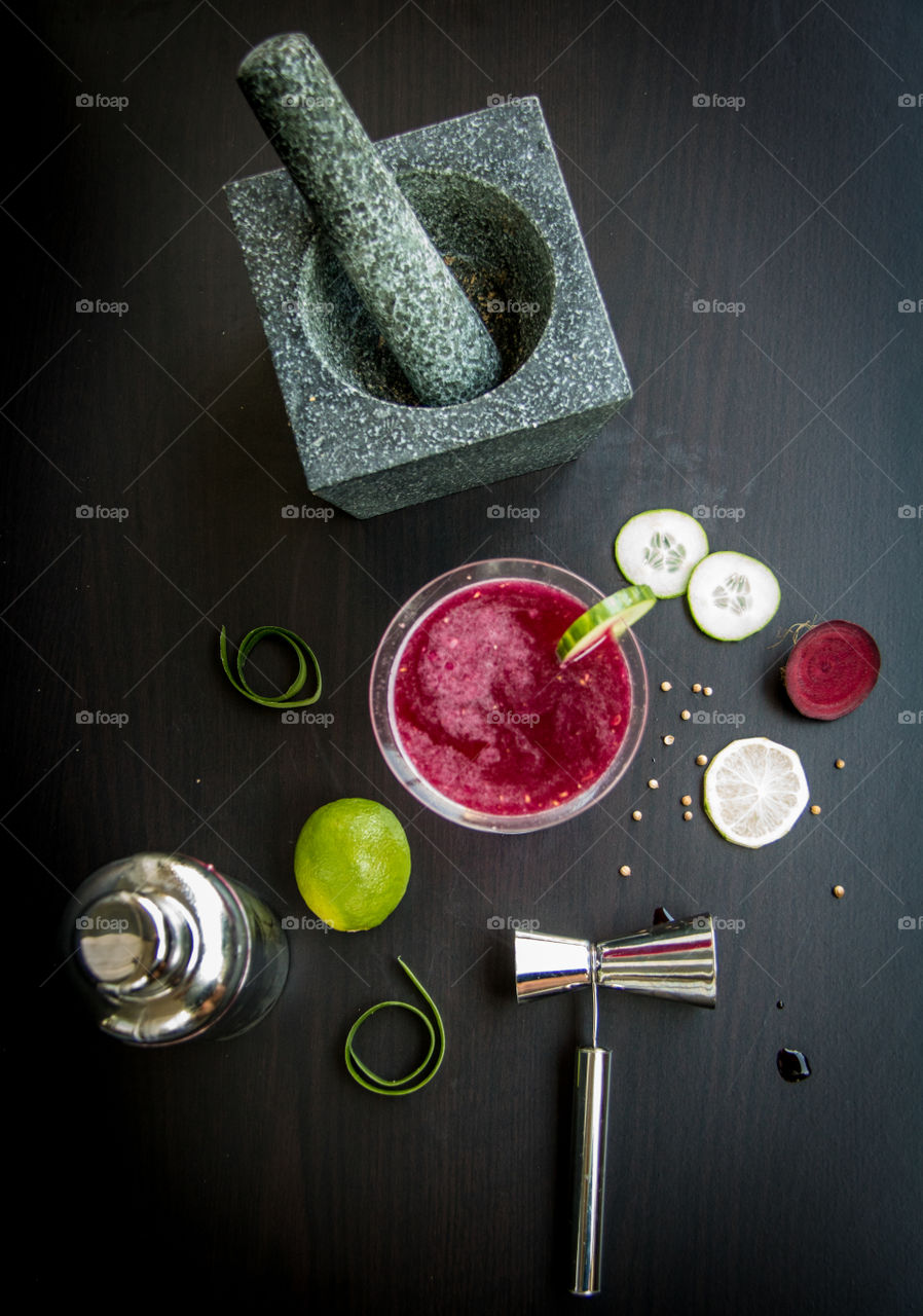 Homemade cucumber and lime vodka with coriander and beetroot syrup 