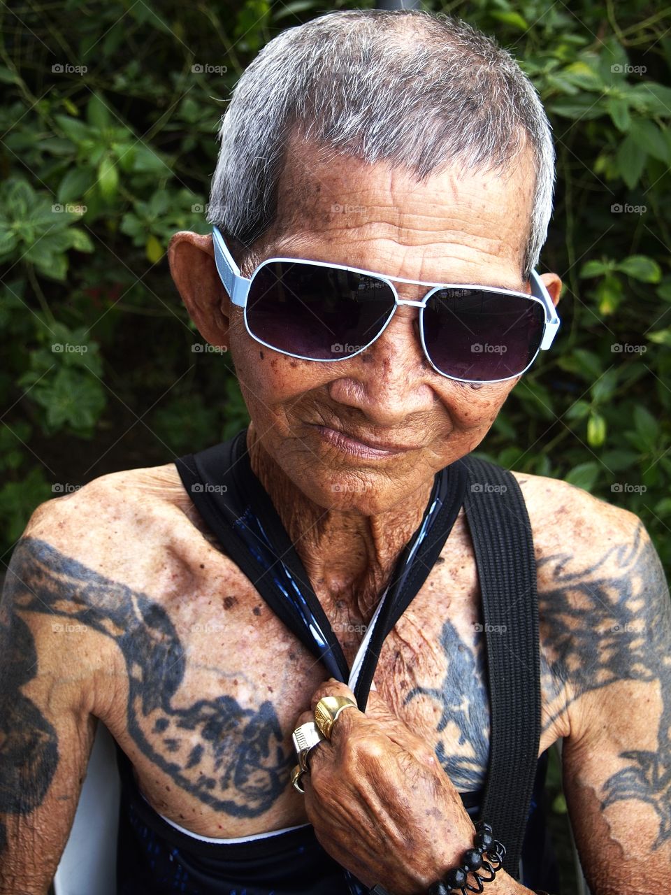 portrait of an old man with tattoos