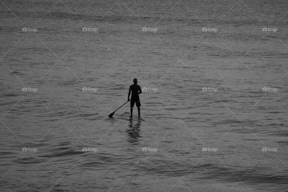 Lone paddle boarder 