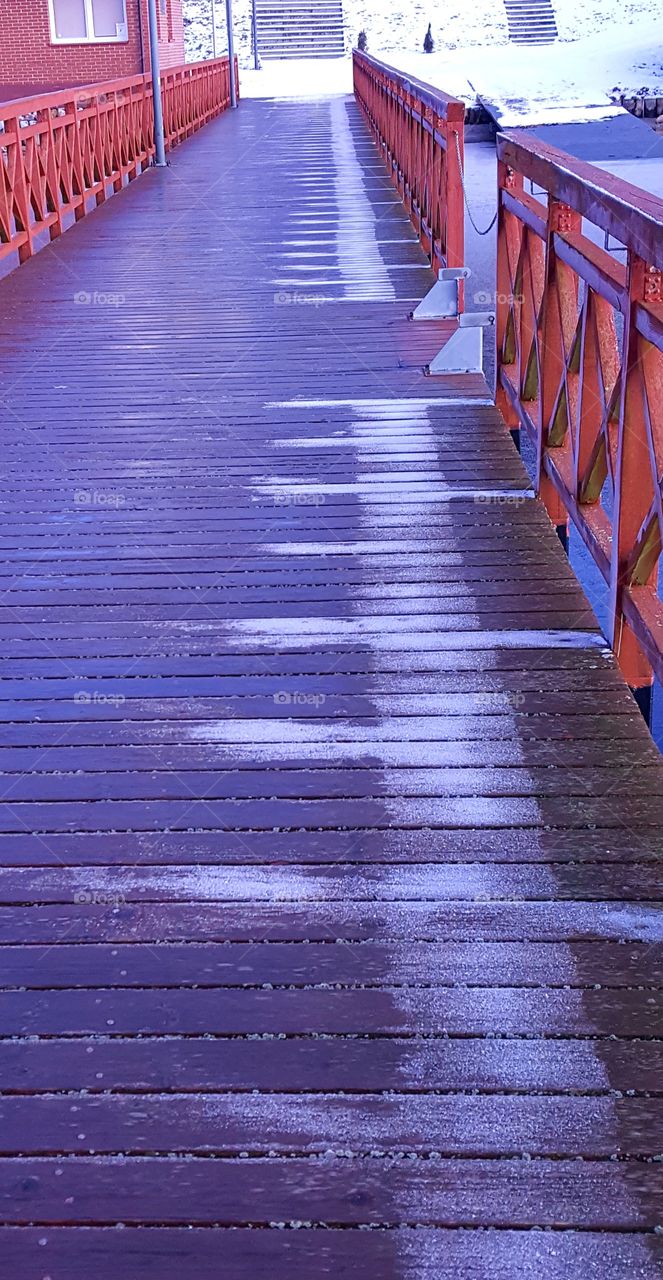 Winter patterns on a wooden pier.
