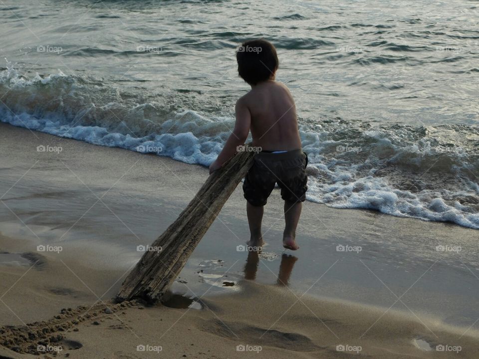 boy playing at beach