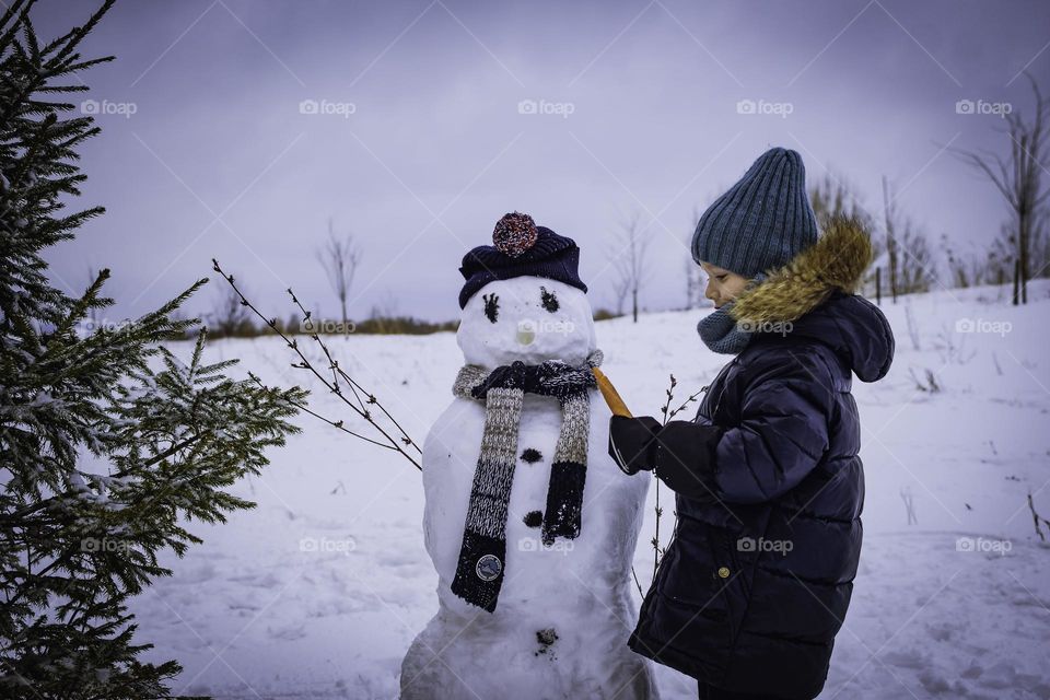 The boy made a snowman.