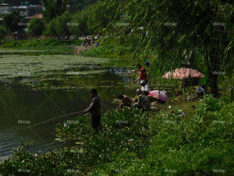 fishermen on lake