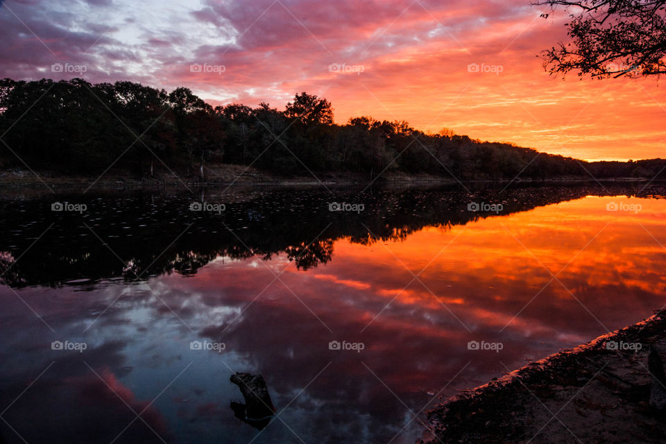 Dramatic sky reflecting on river