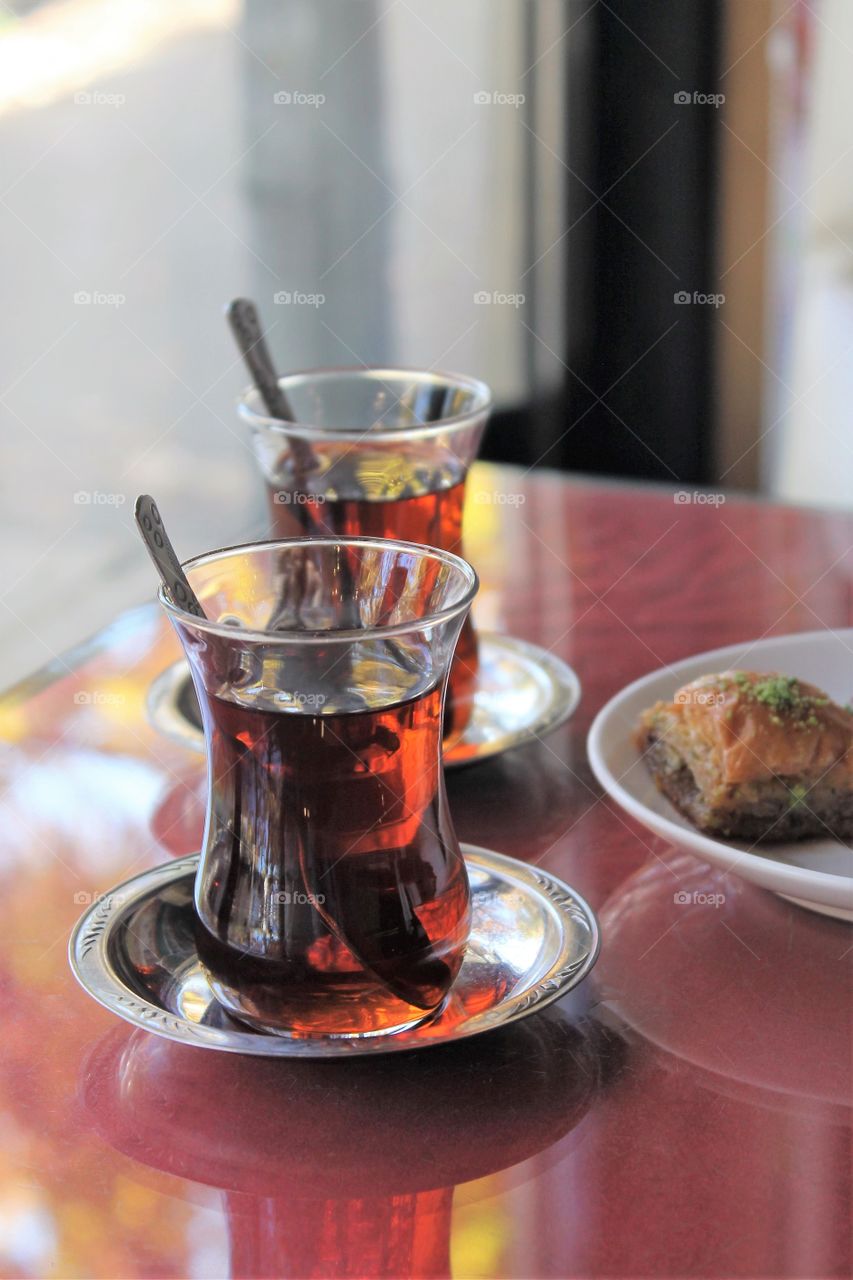 Turkish tea in cups and oriental sweets on a plate