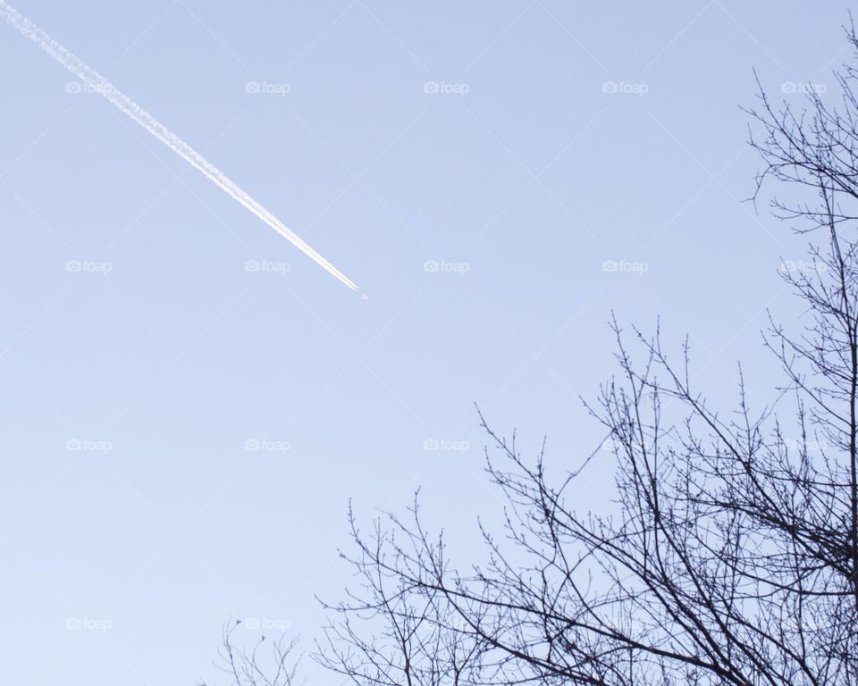 Stream line across a dull blue sky